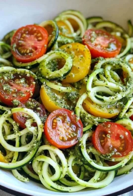 Raw Spiralized Zucchini Noodles with Tomatoes and Pesto