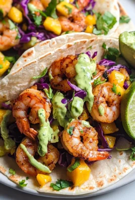 Spicy Shrimp Tacos with Mango Slaw and Avocado Crema
