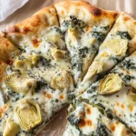 artichoke pizza with spinach parmesan cream sauce